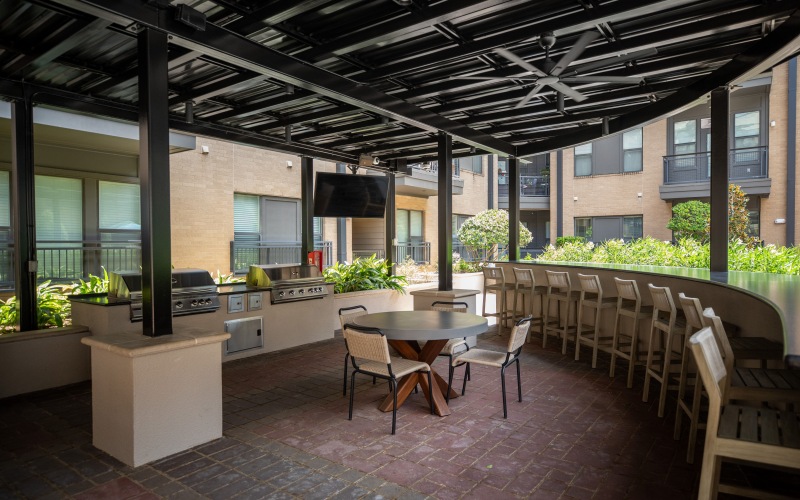 outdoor covered grill area with ample seating at briscoe river oaks in houston, tx