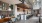 community area with a coffee bar, accent colored furniture, plenty of seating areas and a shuffleboard