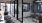 work space with multiple chairs, open glass walls and colored accent walls
