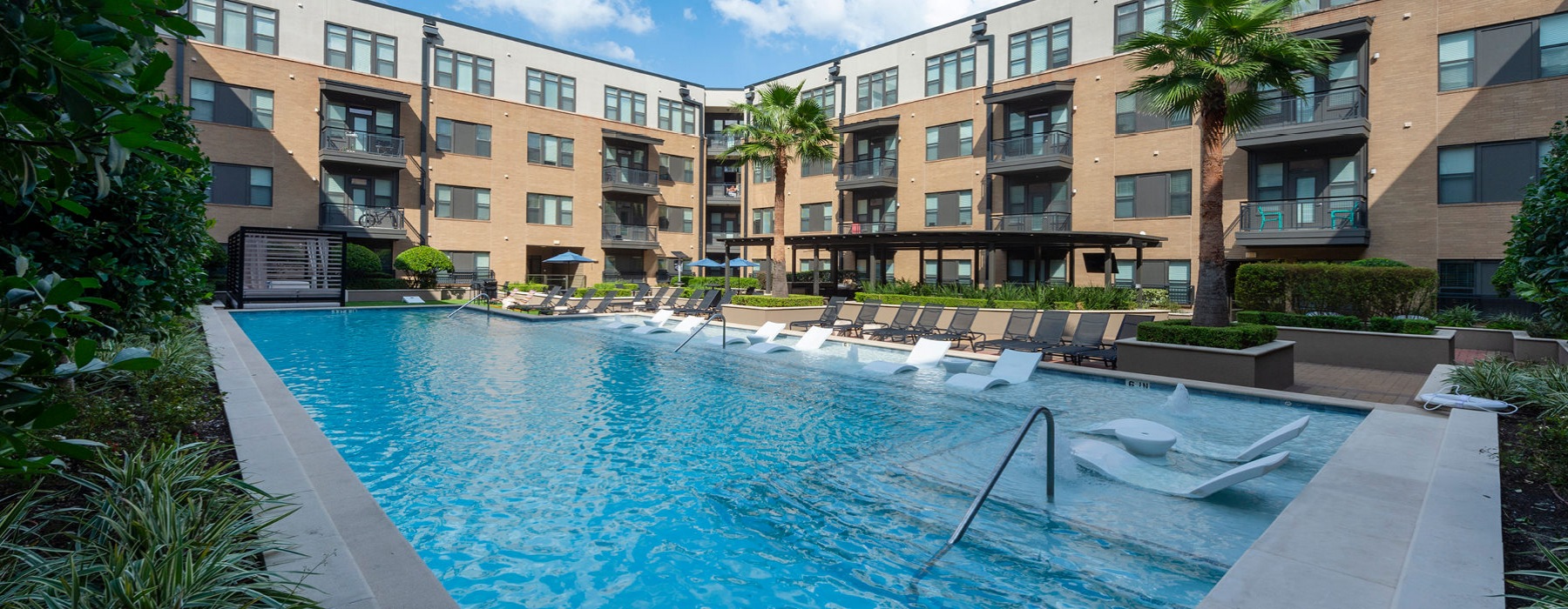 pool deck with spa and ledge loungers 